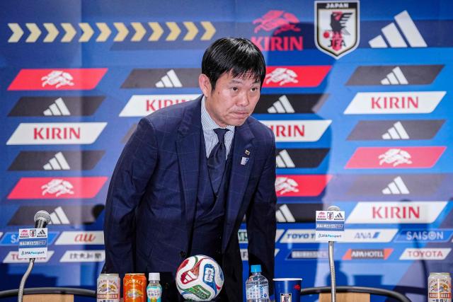 Japan's football head coach Hajime Moriyasu bows as he arrives for a press conference in Tokyo on July 2, 2026. (Photo by Yuichi YAMAZAKI / AFP)