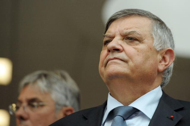 (FILES) The Prefect of Seine-Saint-Denis, Christian Lambert, listens to a briefing during a visit to the information and command centre in Bobigny with Interior Minister Brice Hortefeux on August 9, 2010. Christian Lambert, former head of the RAID who led the operations that resulted in the arrest of Yvan Colonna, and former prefect of Seine-Saint-Denis, has died at the age of 80, France's Interior Minister Laurent Nunez announced on July 2, 2026. (Photo by Miguel MEDINA / AFP)