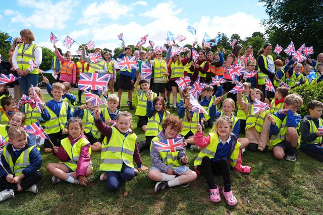 Children await the arrival of Britain's King Charles III for his visit to coincide with the Jethart Callant Festival in Jedburgh, Scotland on July 2, 2026. (Photo by Aaron Chown / POOL / AFP)