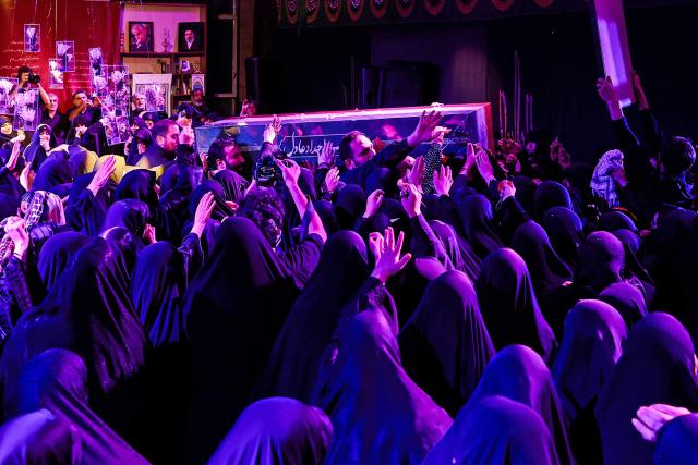 Mourners carry the coffin of Zahra Haddad Adel, wife of Iran's supreme leader Mojtaba Khamenei, during her funeral in Tehran on July 2, 2026. Mojtaba Khamenei's wife, Zahra Haddad Adel, the daughter of former parliament speaker Gholam Ali Haddad Adel, died on February 28 in the US-Israeli strikes that killed ex-supreme leader Khamenei, according to the Iranian authorities. (Photo by FARS NEWS AGENCY / AFP)