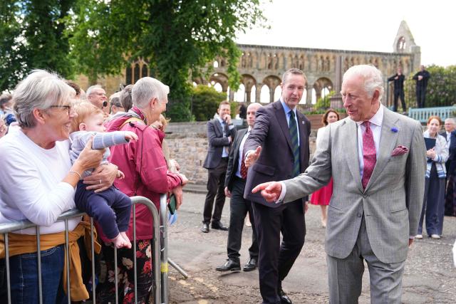 Britain's King Charles III (R) meets members of the public during a visit to coincide with the Jethart Callant Festival in Jedburgh, Scotland on July 2, 2026. (Photo by Aaron Chown / POOL / AFP)
