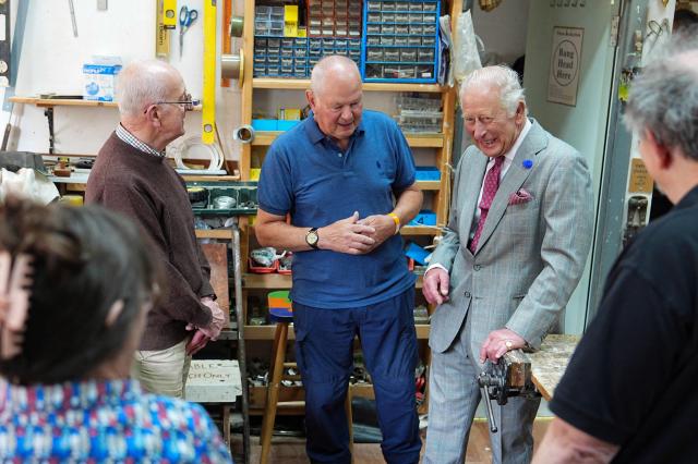 Britain's King Charles III (R) meets members of the public in the Jed Shed during a visit to coincide with the Jethart Callant Festival in Jedburgh, Scotland on July 2, 2026. (Photo by Aaron Chown / POOL / AFP)