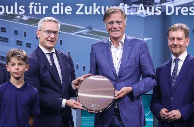 (2ndL-R) German Minister for Digitalization and State Modernization Karsten Wildberger, CEO of Infineon Jochen Hanebeck and Saxony's State Premier Michael Kretschmer pose with a 300mm wafer during the opening ceremony of the Infineon Smart Power Fab in Dresden, eastern Germany, on July 2, 2026. German semiconductor giant Infineon officially opens a large new chip factory in eastern Germany on July 2, three months ahead of schedule. The new, highly automated plant -- which cost 5 billion euros ($5.7 billion) -- has been repeatedly held up as a symbol of the European Union's push to bolster the domestic tech sector and reduce dependency for crucial parts on Asia and the United States. (Photo by Ronny HARTMANN / AFP)