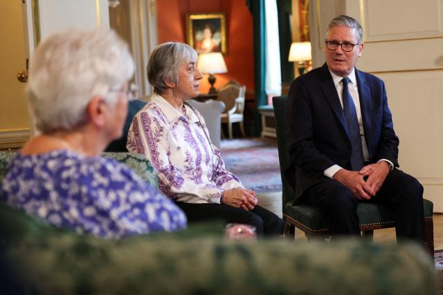 Britain's Prime Minister Keir Starmer (R) attends a meeting with campaigners to discuss historical forced adoption, at Downing Street in London on July 2, 2026. (Photo by Isabel Infantes / POOL / AFP)