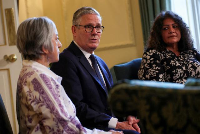 Britain's Prime Minister Keir Starmer (C) attends a meeting with campaigners to discuss historical forced adoption, at Downing Street in London on July 2, 2026. (Photo by Isabel Infantes / POOL / AFP)