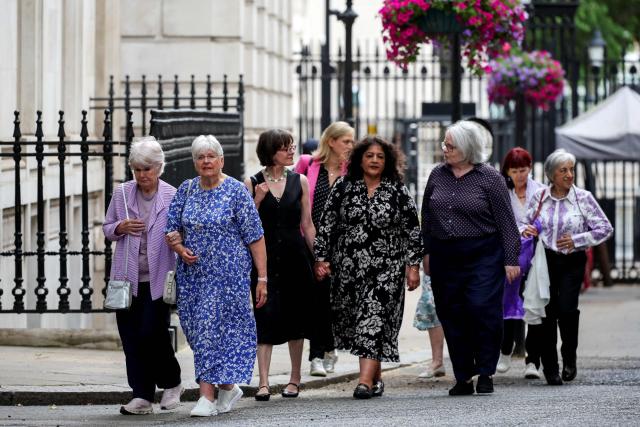 Campaigners arrive for a meeting with Britain's Prime Minister Keir Starmer at Downing Street, to discuss historical forced adoption, in London on July 2, 2026. (Photo by Isabel Infantes / POOL / AFP)