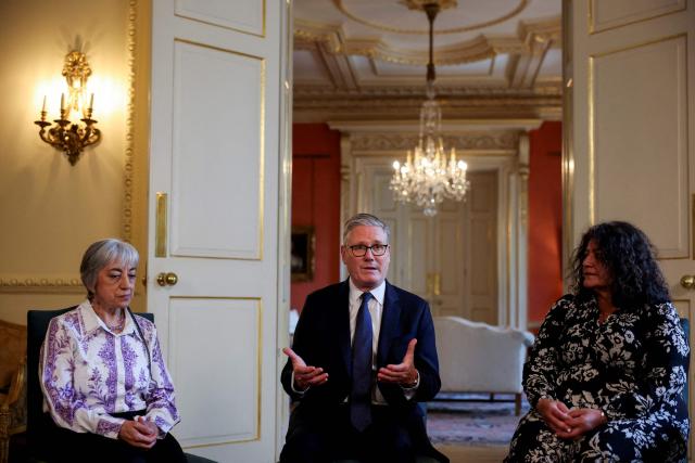 Britain's Prime Minister Keir Starmer (C) speaks during a meeting with campaigners to discuss historical forced adoption, at Downing Street in London on July 2, 2026. (Photo by Isabel Infantes / POOL / AFP)