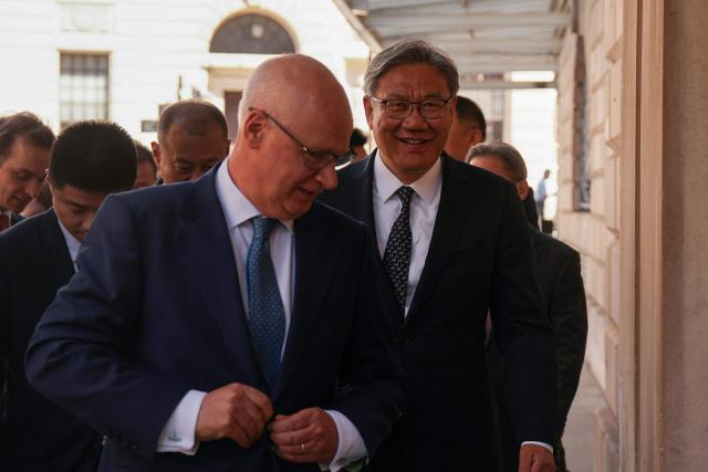 China’s Commerce Minister Wang Wentao (R) arrives to attend the 15th UK–China Joint Economic and Trade Commission with his British counterparts at Mansion House in central London on July 2, 2026. (Photo by CARLOS JASSO / AFP)