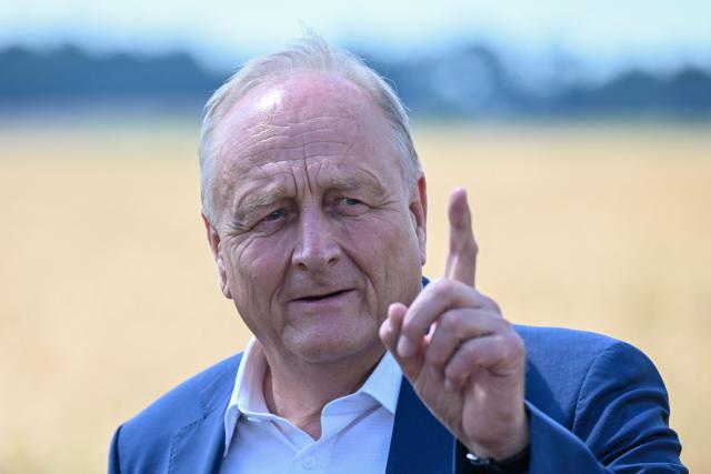 Joachim Rukwied, President of the German Farmers' Association (Deutscher Bauernverband) gestures during a press conference of the German Farmers’ Association to mark the start of the harvest in Gross Machnow, eastern Germany, on July 2, 2026. (Photo by RALF HIRSCHBERGER / AFP)