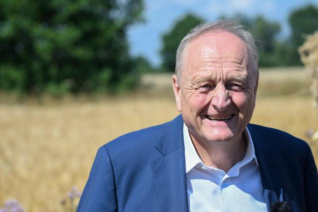 Joachim Rukwied, President of the German Farmers' Association (Deutscher Bauernverband) gestures during a press conference of the German Farmers’ Association to mark the start of the harvest in Gross Machnow, eastern Germany, on July 2, 2026. (Photo by RALF HIRSCHBERGER / AFP)