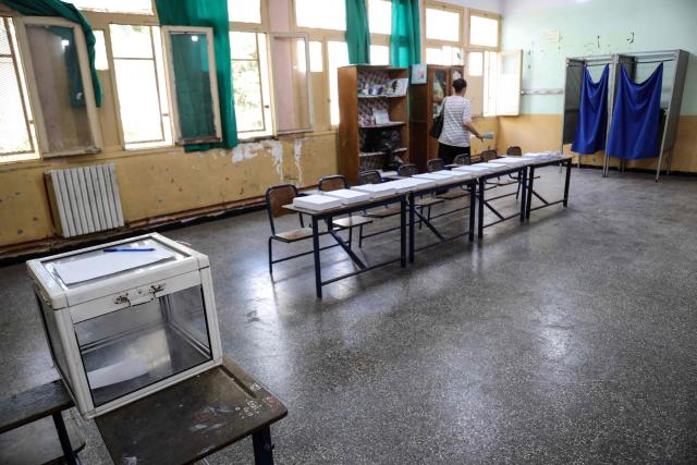 A woman prepares to cast her ballot at a polling station during parliamentary elections in Algiers on July 2, 2026. Algerians headed to the polls on July 2 to elect a new parliament in an election shadowed by expectations of low turnout among the 25-million-person electorate. (Photo by AFP)