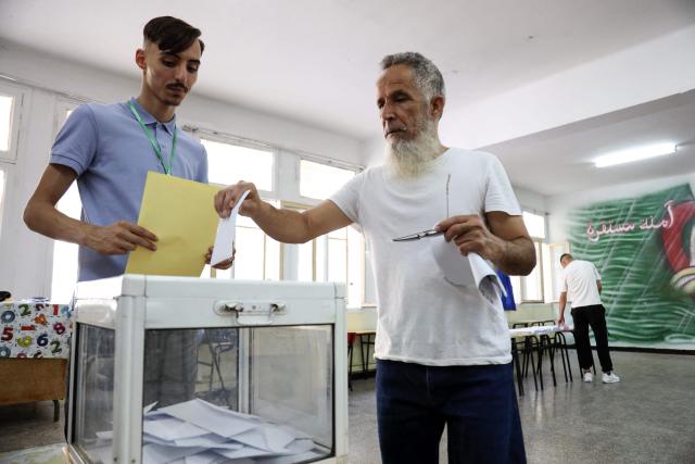 A man casts his ballot at a polling station during parliamentary elections in Algiers on July 2, 2026. Algerians headed to the polls on July 2 to elect a new parliament in an election shadowed by expectations of low turnout among the 25-million-person electorate. (Photo by AFP)