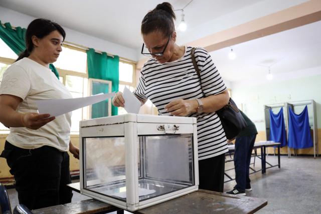 A woman casts her ballot at a polling station during parliamentary elections in Algiers on July 2, 2026. Algerians headed to the polls on July 2 to elect a new parliament in an election shadowed by expectations of low turnout among the 25-million-person electorate. (Photo by AFP)