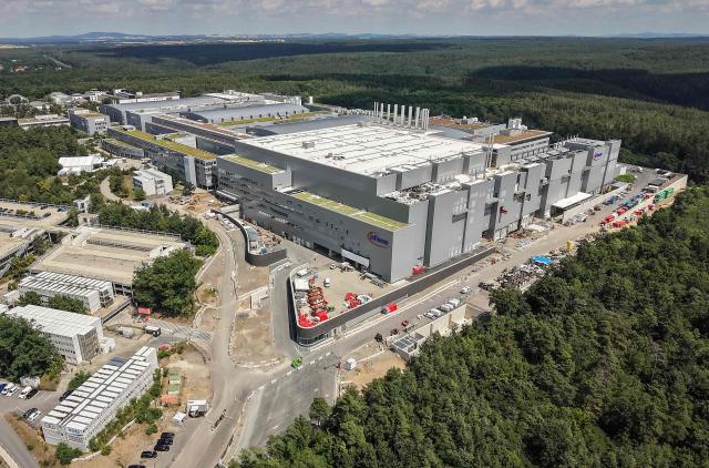 This aerial view shows the new Smart Power Fab of German semiconductor manufacturer Infineon Technologies AG in Dresden, eastern Germany, on July 2, 2026. German semiconductor giant Infineon opened a five-billion-euro ($5.7 billion) microchip plant on July 2, at a time Europe seeks to bolster its high-tech autonomy. The "Smart Power Fab" in the eastern city of Dresden, completed three months ahead of schedule, has been hailed as a symbol of an EU push to reduce dependency for crucial parts on Asia and the United States. (Photo by Ronny HARTMANN / AFP)