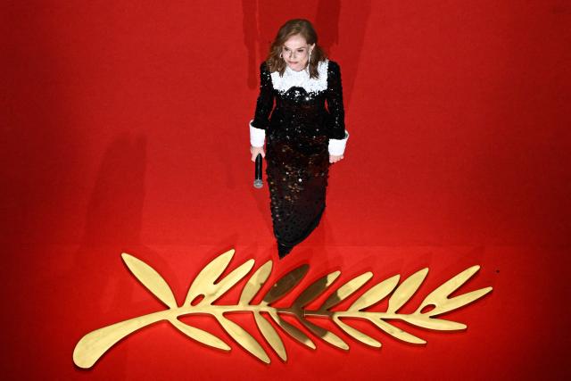 (FILES) French actress Isabelle Huppert receives on behalf of US singer and actress Barbra Streisand the Honorary Palme d'Or during the closing ceremony of the 79th edition of the Cannes Film Festival in Cannes, southern France, on May 23, 2026. On July 2, 2026, actress Isabelle Huppert became the first woman to be elected president of the Cinematheque Francaise, a prestigious institution dedicated to preserving the heritage of cinema, the organisation announced in a press release. At the age of 73, she succeeds the Franco-Greek filmmaker Costa-Gavras, aged 93, who has been president of the Cinematheque since 2007. She was elected by the board of directors for a three-year term, running until 2029. (Photo by Antonin THUILLIER / AFP)