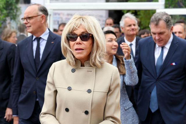 French President's wife Brigitte Macron (C) and Former French Prime Minister Edouard Philippe (L) take part in the inauguration of the CMA-CGM container ship the "Notre Dame", France's largest container ship, in Le Havre, Northeastern France on July 2, 2027. With 400 meters long, 62 meters wide, and 75 meters high, the CMA CGM Notre-Dame, which will operate on the Asia–Europe sea route, is designed to carry up to 24,212 containers. (Photo by ALAIN JOCARD / AFP)
