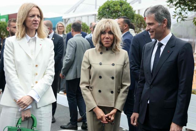 French fashion house Dior's head and Executive Vice-President of Louis Vuitton Delphine Arnault (L) stands next to France's President's wife Brigitte Macron (C) and CMA CGM Group Chairman and CEO Rodolphe Saade (R) while taking part in the inauguration of the CMA-CGM container ship the "Notre Dame", France's largest container ship, in Le Havre, Northeastern France on July 2, 2026. as CMA CGM Group Chairman and CEO Rodolphe Saade (partly hidden) and Former French Prime Minister and Mayor of Le Havre Edouard Philippe take part in the inauguration of the CMA-CGM container ship the "Notre Dame", France's largest container ship, in Le Havre, Northeastern France on July 2, 2026. With 400 meters long, 62 meters wide, and 75 meters high, the CMA CGM Notre-Dame, which will operate on the AsiaEurope sea route, is designed to carry up to 24,212 containers. (Photo by Alain JOCARD / AFP)