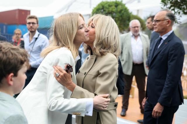 French fashion house Dior's head and Executive Vice-President of Louis Vuitton Delphine Arnault (L) greets France's President's wife Brigitte Macron (C) as former French Prime Minister and Mayor of Le Havre Edouard Philippe looks on while taking part in the inauguration of the CMA-CGM container ship the "Notre Dame", France's largest container ship, in Le Havre, Northeastern France on July 2, 2026. With 400 meters long, 62 meters wide, and 75 meters high, the CMA CGM Notre-Dame, which will operate on the AsiaEurope sea route, is designed to carry up to 24,212 containers. (Photo by Alain JOCARD / AFP)
