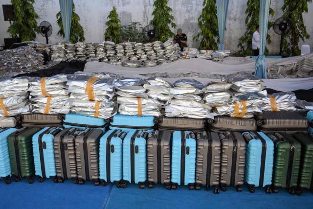 Packages of seized cannabis buds are displayed during a press conference in Gresik, East Java Province, on July 2, 2026. The National Narcotics Agency (BNN) in collaboration with Customs and the police foiled an attempt to smuggle 3.37 metric tons of cannabis buds from Thailand and apprehended 12 suspected perpetrators. (Photo by Juni KRISWANTO / AFP)