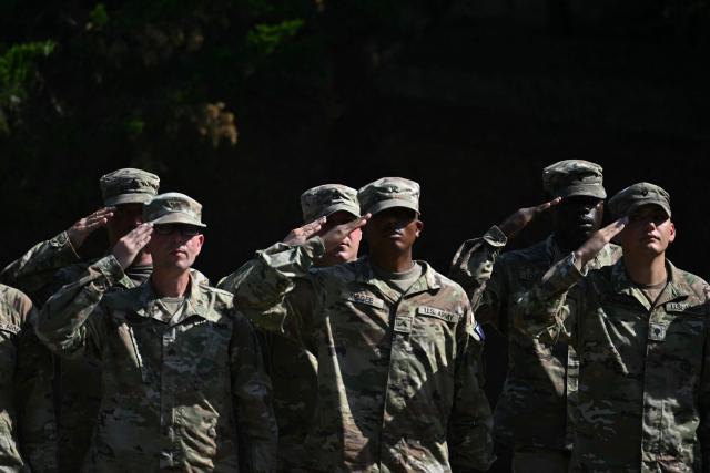 Members of the National Guard salute as US Secretary of Defense Pete Hegseth hosts a “DC Safe and Beautiful Task Force” ceremony at Meridian Hill Park in Washington, DC, on July 2, 2026. (Photo by Kent NISHIMURA / AFP)