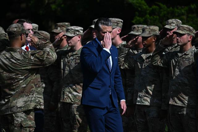 US Secretary of Defense Pete Hegseth salutes as he walks past members of the National Guard during a “DC Safe and Beautiful Task Force” ceremony at Meridian Hill Park in Washington, DC, on July 2, 2026. (Photo by Kent NISHIMURA / AFP)