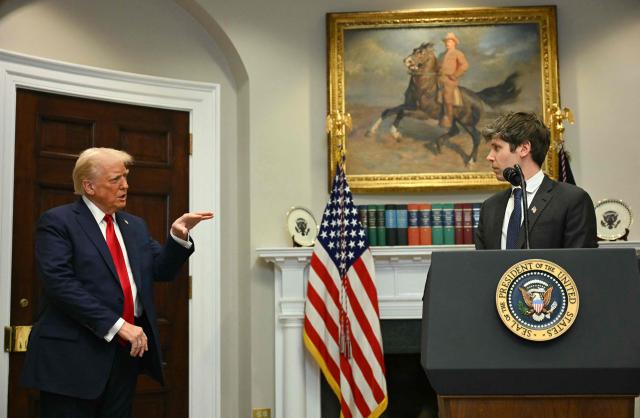 (FILES) US President Trump gestures as CEO of Open AI Sam Altman speaks in the Roosevelt Room at the White House on January 21, 2025, in Washington, DC. OpenAI has discussed giving the US government a five percent ownership stake as the artificial intelligence giant seeks to smooth relations with the Trump administration, the Financial Times reported on July 2, 2026. CEO Sam Altman has argued that giving the public a financial stake in the $852 billion company is the best way to share the benefits of AI. (Photo by Jim WATSON / AFP)