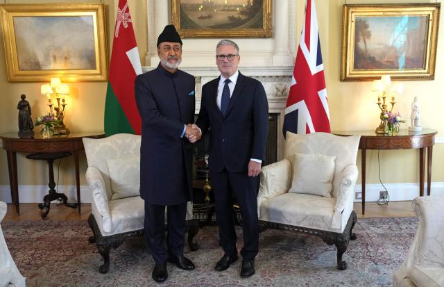 Britain's Prime Minister Keir Starmer (R) shakes hands with Oman's Sultan Haitham bin Tarik during their meeting inside 10 Downing Street for a meeting, in central London on July 2, 2026. (Photo by CARLOS JASSO / POOL / AFP)