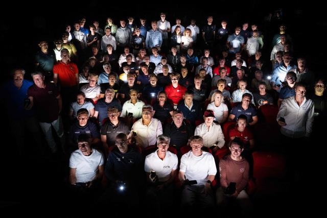 Skippers pose for a family picture during the kick-off of the 13th Route du Rhum at the Hermine theater in Saint-Malo, western France on June 30, 2026. From Saint-Malo in Brittany to Pointe-à-Pitre in Guadeloupe, over 100 skippers across 6 classes will take the start on November 1, 2026, in this solo transatlantic sailing race. (Photo by Julien DE ROSA / AFP)