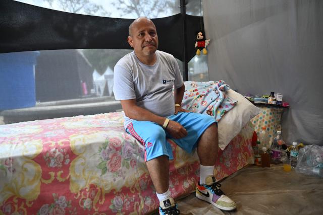 Luis Chacon remains at a displaced camp at the Ali West Park in Caracas on July 2, 2026, eight days after twin earthquakes. Hundreds of rescuers in Venezuela cheered and embraced on July 2, 2026 after pulling 43-year-old Hernan Gil from the ruins of a collapsed building eight days after deadly twin earthquakes, AFP journalists witnessed. (Photo by MARTIN BERNETTI / AFP)