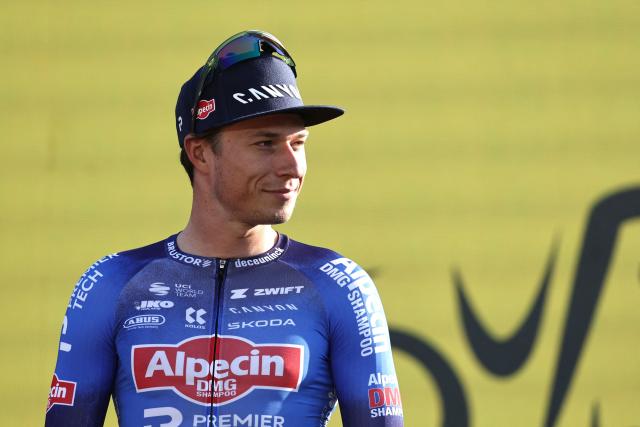 Alpecin - Premier Tech team's Belgian rider Jasper Philipsen attends the team presentation ceremony ahead of the 113th edition of the Tour de France cycling race, with the Sagrada Familia Basilica  seen in the background, in Barcelona, northeastern Spain, on July 2, 2026. (Photo by Anne-Christine POUJOULAT / AFP)