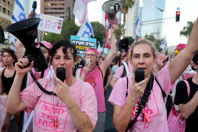 Israeli protesters hold placards and shout slogans during a rally against the government and the war in Gaza, at Hostage Square in Tel Aviv, on July 2, 2026, marking 1000 days since Hamas's October 7, 2023 attack on Israel. Israelis called on July 2 for a state commission of inquiry into Hamas's October 7, 2023 attack, as the country marked 1,000 days since the deadliest event in its history, which triggered the war in Gaza. A series of sombre commemorations were being held across the country, as well as protests against the government's handling of events during and after the attack. (Photo by Jack GUEZ / AFP)
