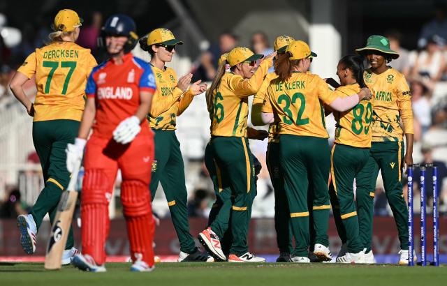 South Africa's Shabnim Ismail (2R) celebrates with teammates after  dismissing England's Alice Capsey for one run during the ICC Women's Twenty20 (T20) cricket world cup 2026 semi-final game between England and South Africa, at The Oval in London on July 2, 2026. (Photo by JUSTIN TALLIS / AFP)