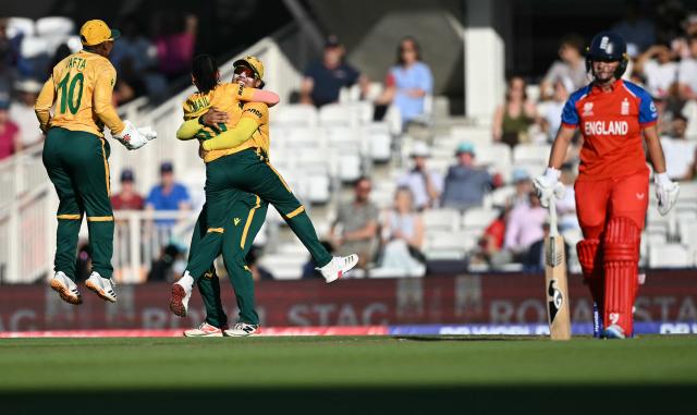 South Africa's Shabnim Ismail (2L) celebrates taking the wicket of England's Alice Capsey for one run during the ICC Women's Twenty20 (T20) cricket world cup 2026 semi-final game between England and South Africa, at The Oval in London on July 2, 2026. (Photo by JUSTIN TALLIS / AFP)