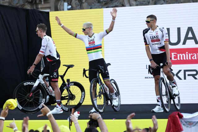 UAE Team Emirates - XRG's Slovenian rider Tadej Pogacar (C) attends the team presentation ceremony ahead of the 113th edition of the Tour de France cycling race, in Barcelona, northeastern Spain, on July 2, 2026. (Photo by Anne-Christine POUJOULAT / AFP)