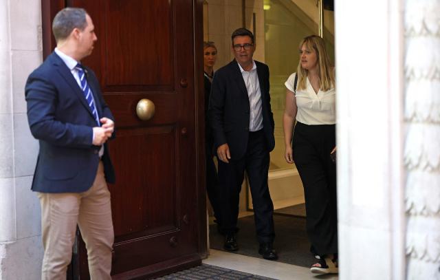 Labour MP and challenger for Leader of the Labour party, Andy Burnham (C), reacts as he leaves from Millbank studios in Westminster, central London, on July 2, 2026, after giving an interview. (Photo by Toby Shepheard / AFP)