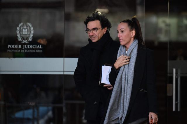Argentine football legend Diego Maradona's Psychiatrist Agustina Cosachov (R) and her lawyer Vadim Mischanchuk (L), leave at the court after a trial hearing on his's death in San Isidro, Buenos Aires province, Argentina on July 2, 2026. (Photo by Luis ROBAYO / AFP)
