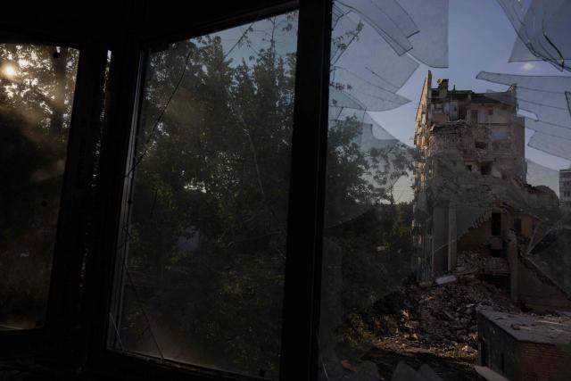 This photograph shows a residential building damaged following a Russian air attack on the Ukrainian capital of Kyiv on July 2, 2026, amid the Russian invasion in Ukraine. Russia launched its largest ever barrage on Kyiv early July 2, 2026, according to the city's mayor, tearing open apartment buildings in an hours-long drone and missile attack that killed at least 21 people. (Photo by Tetiana DZHAFAROVA / AFP)