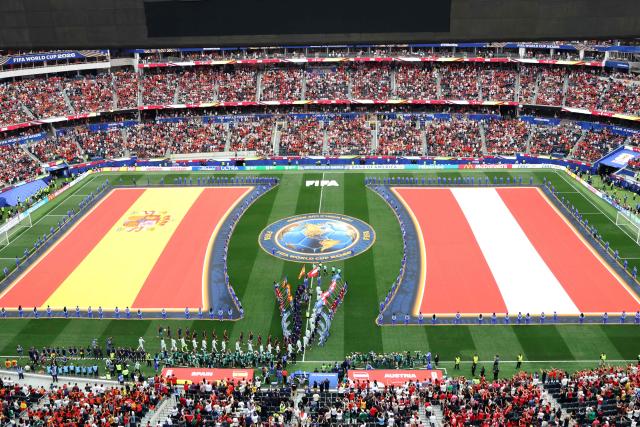 Spain and Austria players enter the pitch ahead of the 2026 World Cup round of 32 football match between Spain and Austria at the Los Angeles Stadium in Inglewood on July 2, 2026.  (Photo by VALERIE MACON / AFP)