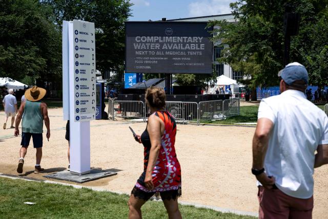 A sign says that complimentary water is available as people visit the "Great American State Fair" on the National Mall in Washington, DC, on July 2, 2026, ahead of the upcoming July 4 holiday. Americans sweltered under furnace-like temperatures this week as central and eastern cities hunkered down for a heat wave set to last through the July 4 holiday weekend. Dozens of local temperature records could be broken, the National Weather Service (NWS) warned, with temperatures in many places to surpass 100 degrees Fahrenheit (38 degrees Celsius) and high humidity pushing the heat index as high as 115 degrees. (Photo by Kent Nishimura / AFP)