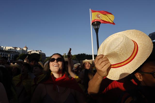 Spain supporters cheer while viewing giant screens showing the Spain vs. Austria FIFA World Cup 2026 round-of-32 football match at Los Angeles Stadium in Inglewood, as seen in Madrid on July 2, 2026. (Photo by Oscar DEL POZO / AFP)