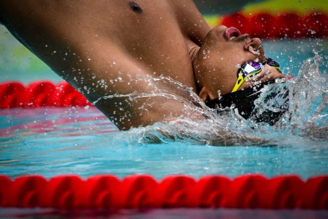 France’s Yohann Ndoye-Brouard competes in the 100 m backstroke final during the French national swimming championships in Saint-Etienne on July 2, 2026. (Photo by OLIVIER CHASSIGNOLE / AFP)