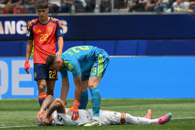 Spain's goalkeeper #23 Unai Simon comforts Austria's forward #07 Marko Arnautovic during the 2026 World Cup round of 32 football match between Spain and Austria at the Los Angeles Stadium in Inglewood on July 2, 2026.  (Photo by Patrick T. Fallon / AFP)
