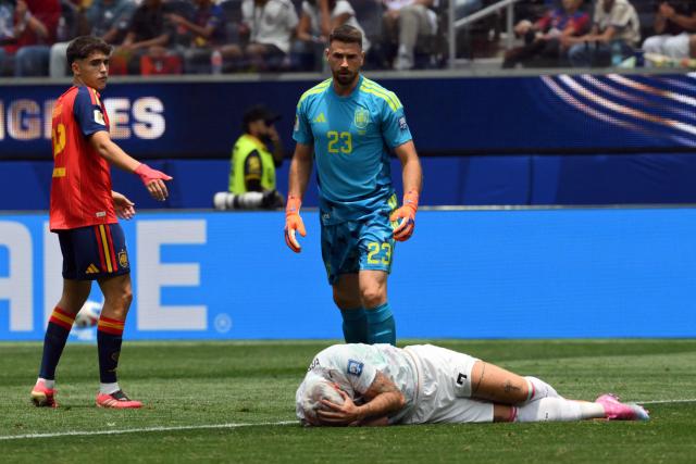 Austria's forward #07 Marko Arnautovic reacts on the ground past Spain's goalkeeper #23 Unai Simon during the 2026 World Cup round of 32 football match between Spain and Austria at the Los Angeles Stadium in Inglewood on July 2, 2026.  (Photo by Patrick T. Fallon / AFP)