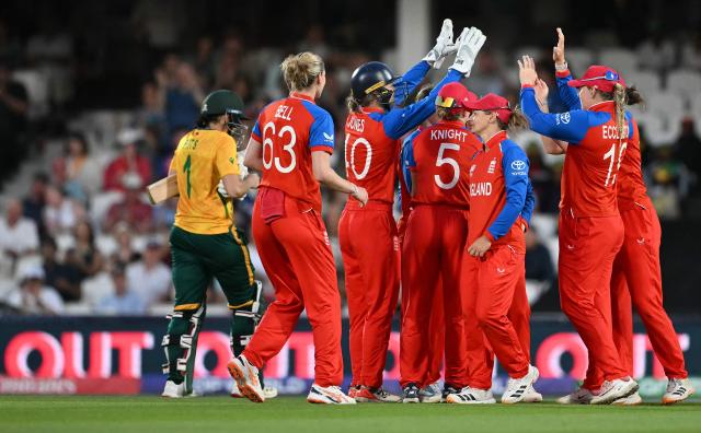 England's captain Nat Sciver-Brunt celebrates with teammates after catching the ball to take the wicket South Africa's Tazmin Brits (L) for 51 runs  during the ICC Women's Twenty20 (T20) cricket world cup 2026 semi-final game between England and South Africa, at The Oval in London on July 2, 2026. (Photo by JUSTIN TALLIS / AFP)