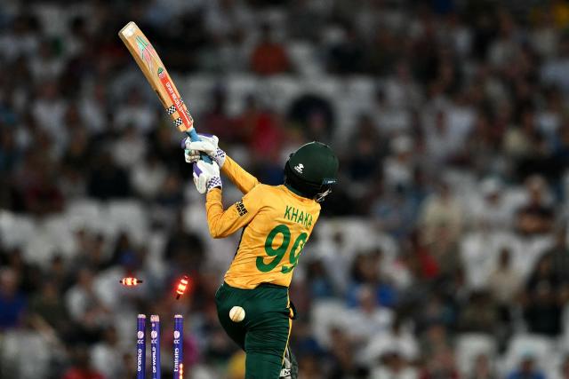 Bails fly as South Africa's Ayabonga Khaka loses their wicket for four runs during the ICC Women's Twenty20 (T20) cricket world cup 2026 semi-final game between England and South Africa, at The Oval in London on July 2, 2026. (Photo by JUSTIN TALLIS / AFP)