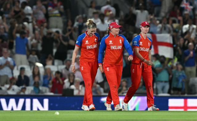 England's Lauren Bell (L) and England's Sophie Ecclestone (C) celebrate after they won the ICC Women's Twenty20 (T20) cricket world cup 2026 semi-final game between England and South Africa, at The Oval in London on July 2, 2026. (Photo by JUSTIN TALLIS / AFP)