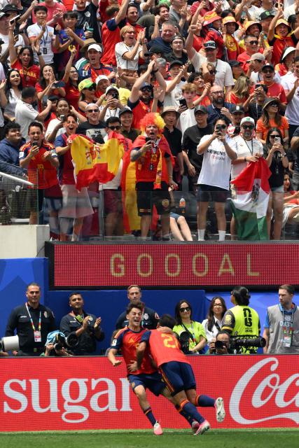 Spain's forward #21 Mikel Oyarzabal (R) celebrates scoring his team's third goal with teammate midfielder #09 Gavi during the 2026 World Cup round of 32 football match between Spain and Austria at the Los Angeles Stadium in Inglewood on July 2, 2026.  (Photo by Patrick T. Fallon / AFP)