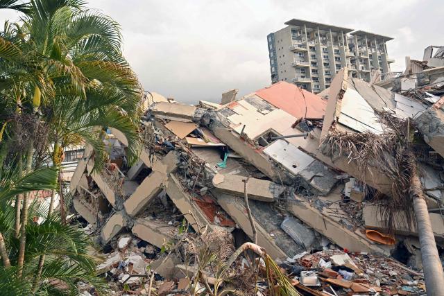 The rubble of a collapsed building is seen in Caraballeda, La Guaira state, Venezuela, on July 2, 2026, eight days after twin earthquakes. Hundreds of rescuers in Venezuela cheered and embraced on July 2, 2026 after pulling 43-year-old Hernan Gil from the ruins of a collapsed building eight days after deadly twin earthquakes, AFP journalists witnessed. (Photo by MARTIN BERNETTI / AFP)