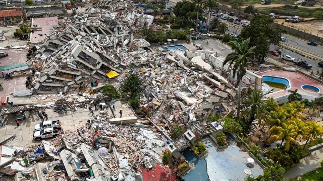This aerial photograph taken on July 2, 2026 in Caraballeda in the state of La Guaira shows collapsed buildings following the June 24 twin earthquakes. More than a week after the earthquakes struck, there is little chance of finding additional survivors from the two earthquakes that killed nearly 2,300 people, destroyed entire residential buildings, and left tens of thousands missing. (Photo by Miguel MEDINA / POOL / AFP)