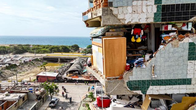 This aerial photograph taken on July 2, 2026 in Caraballeda in the state of La Guaira shows damaged buildings following the June 24 twin earthquakes. More than a week after the earthquakes struck, there is little chance of finding additional survivors from the two earthquakes that killed nearly 2,300 people, destroyed entire residential buildings, and left tens of thousands missing. (Photo by Miguel MEDINA / POOL / AFP)